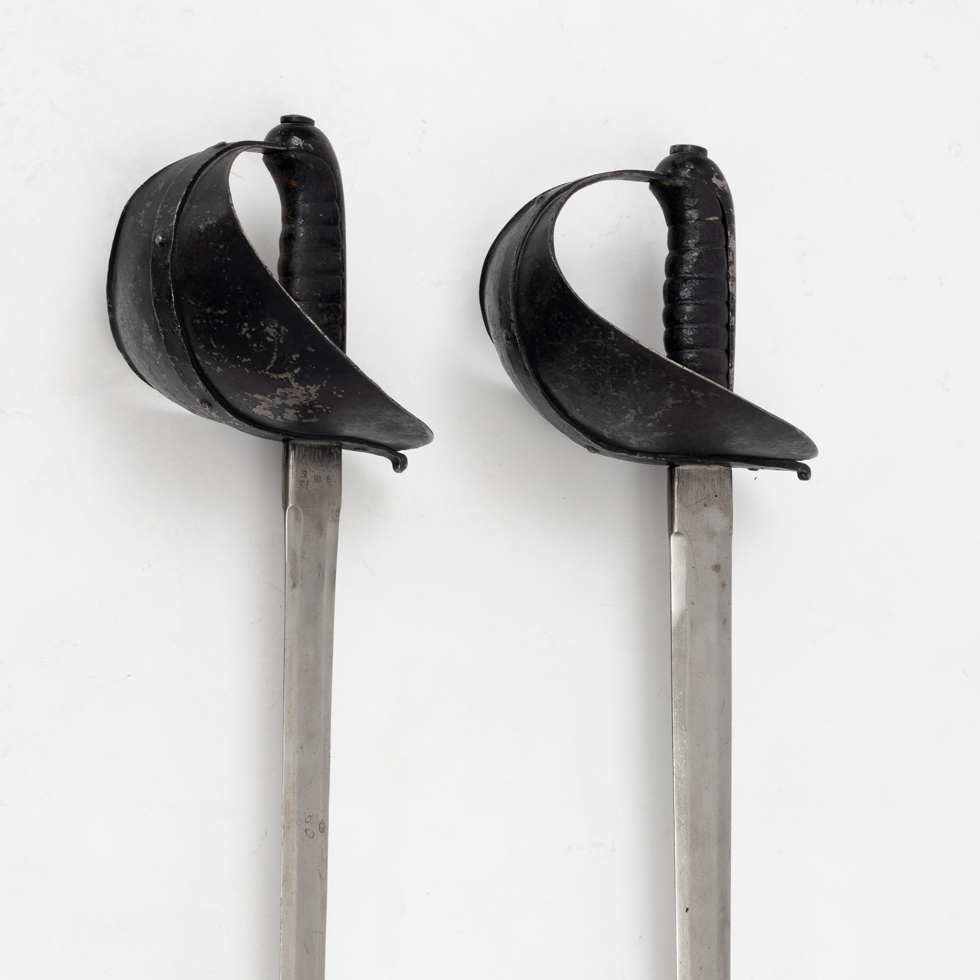 A Swedish pair of military practice swords 1886 pattern.
