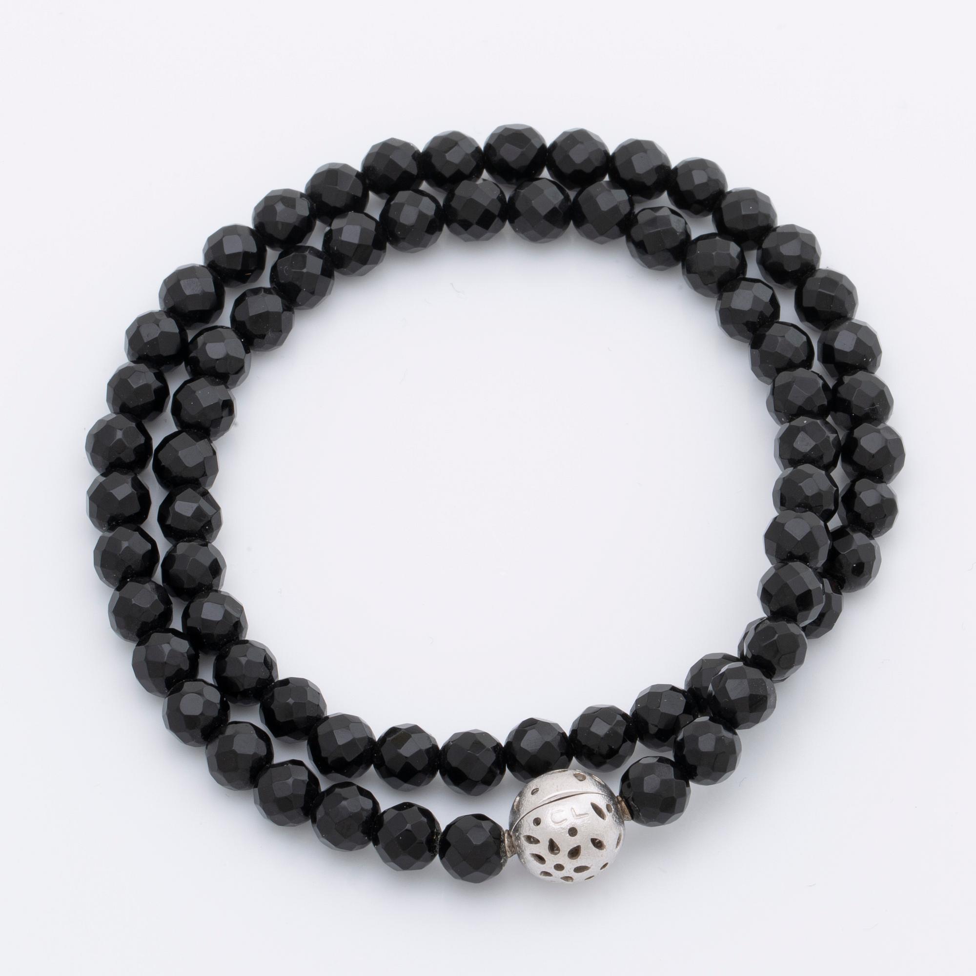 OLE LYNGGAARD necklace, onyx beads approx 6 mm, clasp 18K whitegold approx 10 mm, CL 750 inscribed, original case.