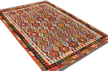 An Afghan Kilim carpet, c. 298 x 202 cm.