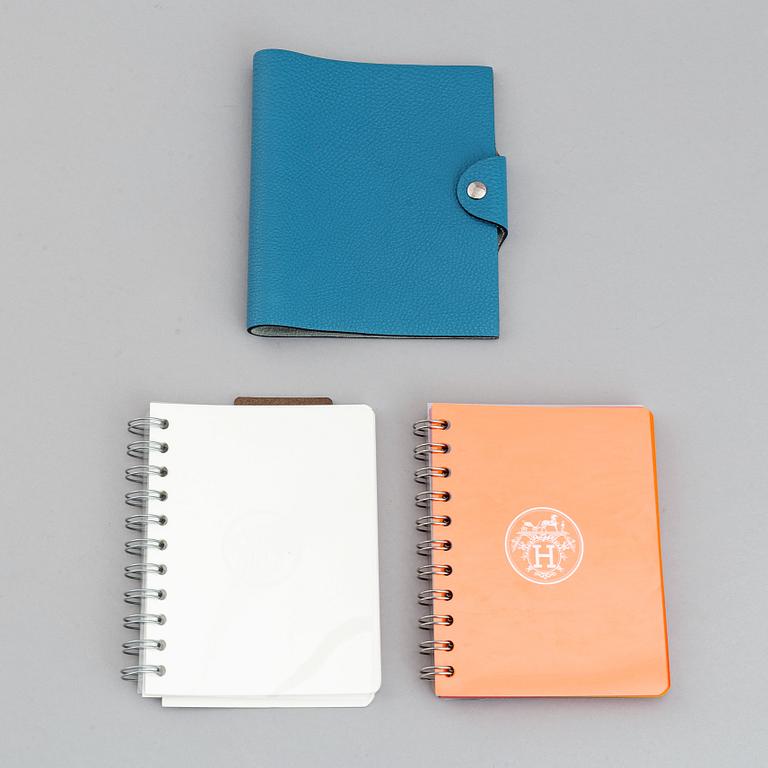Hermès, a blue leather notebook with two scripple pads.