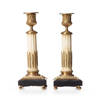 76. A pair of Louis XVI candlesticks.
