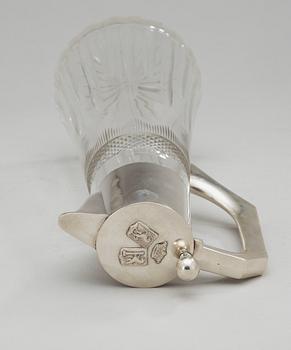 A glass and silver jug, Austria 1901-1921.