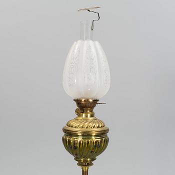 A floor brass paraffin lamp around 1900.