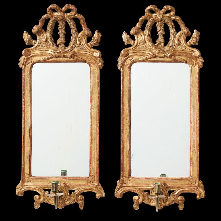 A pair of Gustavian one-light girandole mirrors by Johan Åkerblad, master 1758-1733 in Stockholm.