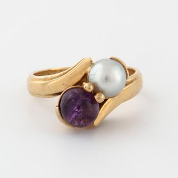 A cultured pearl and cabochon cut amethyst ring by  Stigert, Stockholm, 1955.