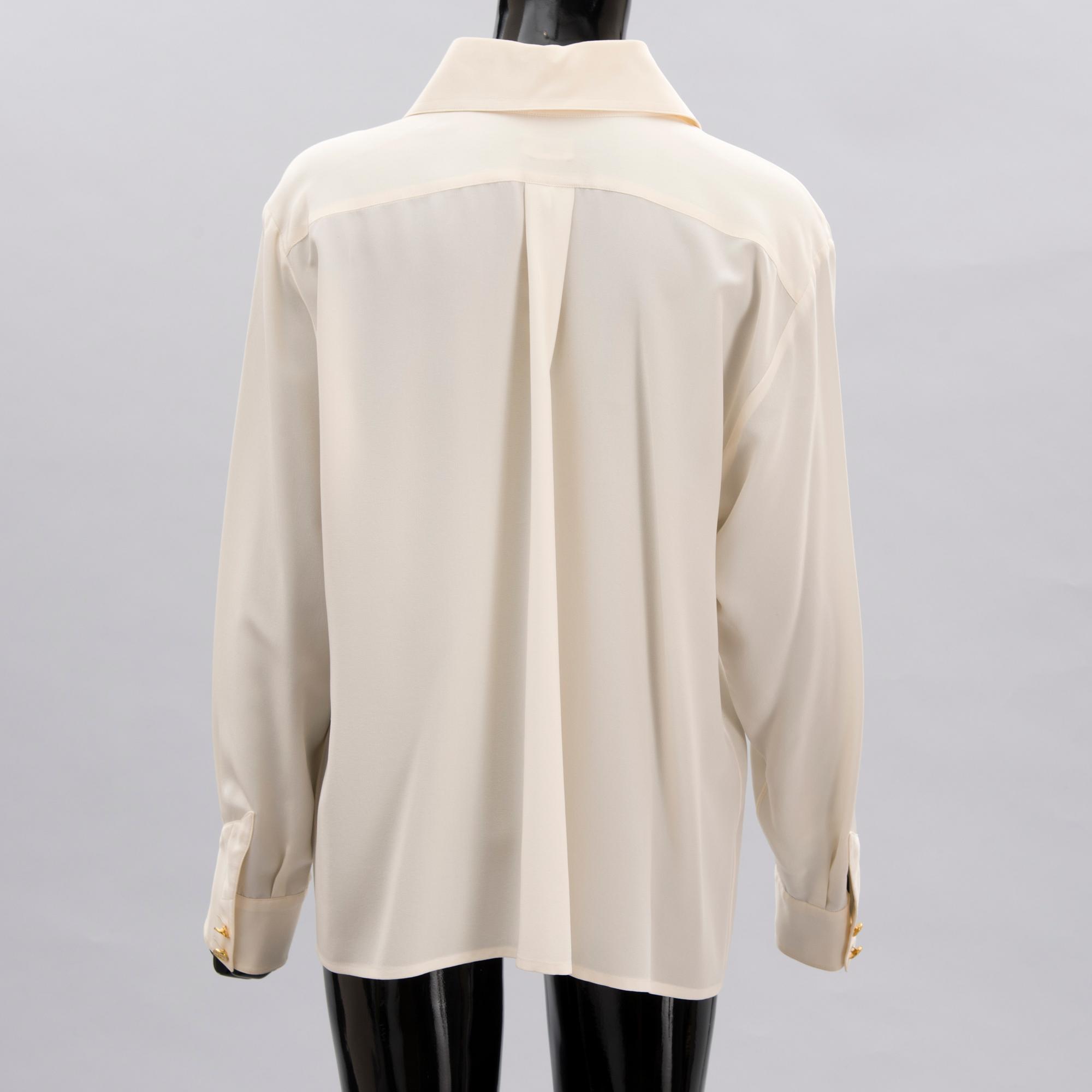 Two Chanel Crepe de Chine Cream Coloured Silk Blouses.