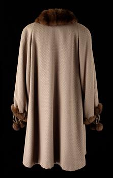 A 1980s fur-trimmed beige silk and wool cape by Louis Féraud.