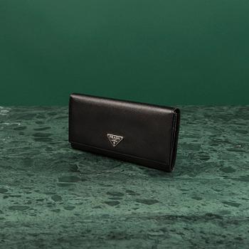 PLÅNBOK, Prada.