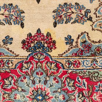 A carpet, old Kerman, approx. 314 x 210 cm.