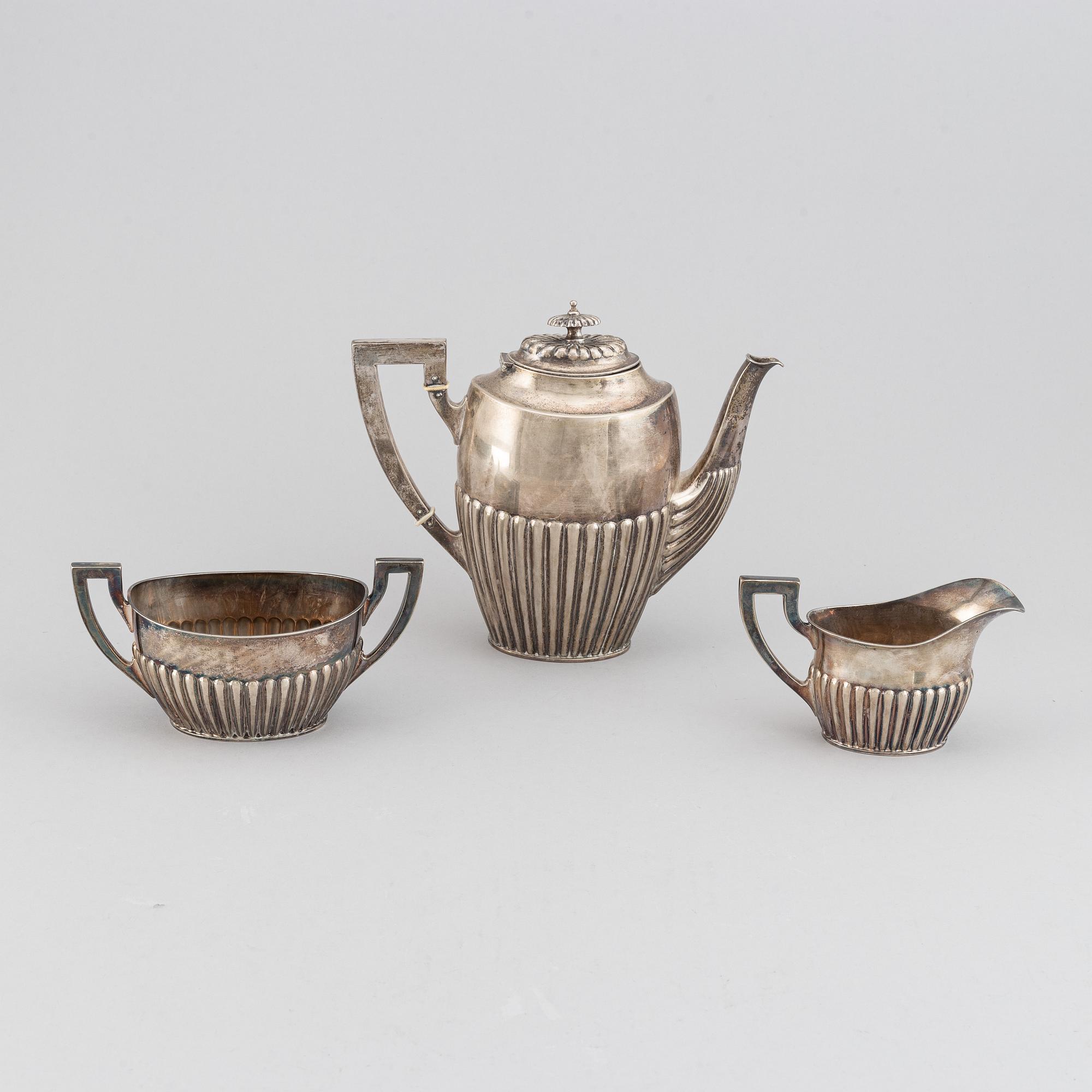 A silver coffee pot, creamer and sugar bowl, AG Dufva, Stockholm 1914.