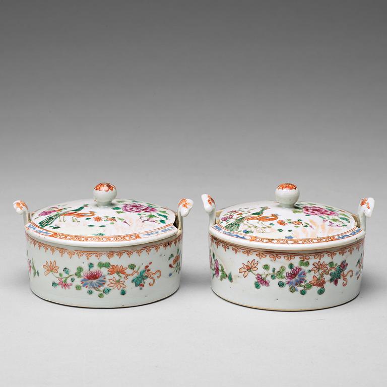 A pair of famille rose 'double peacock' condiment dishes, Qing dynasty, Qianlong (1736-95).