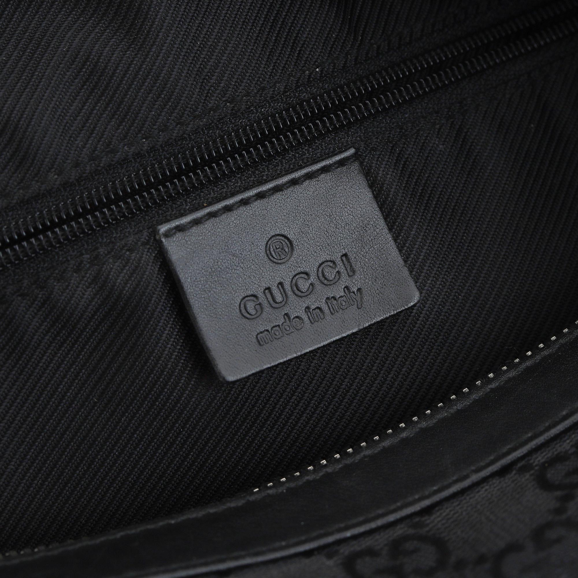 GUCCI, a canvas and leather bag.