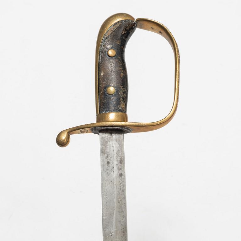 A Swedish police sabre and cutlass, with scabbards.