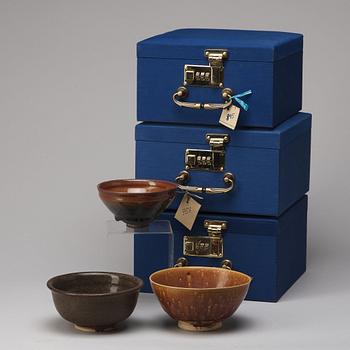 A group of three brown glazed bowls, China, 20th Century.