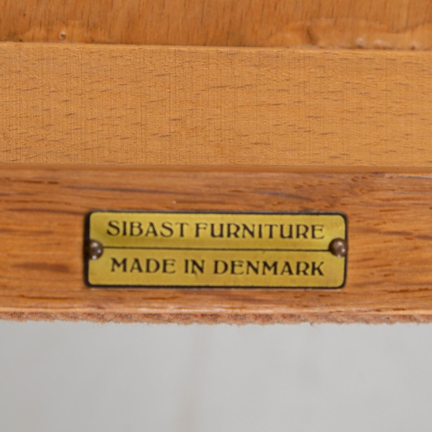 Helge Sibast, A set of four oak and teak chairs, Sibast Furniture, Denmark, mid 20th Century.