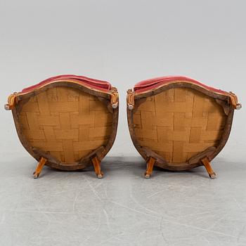 A pair of rococo style easy chairs from around the year 1900.