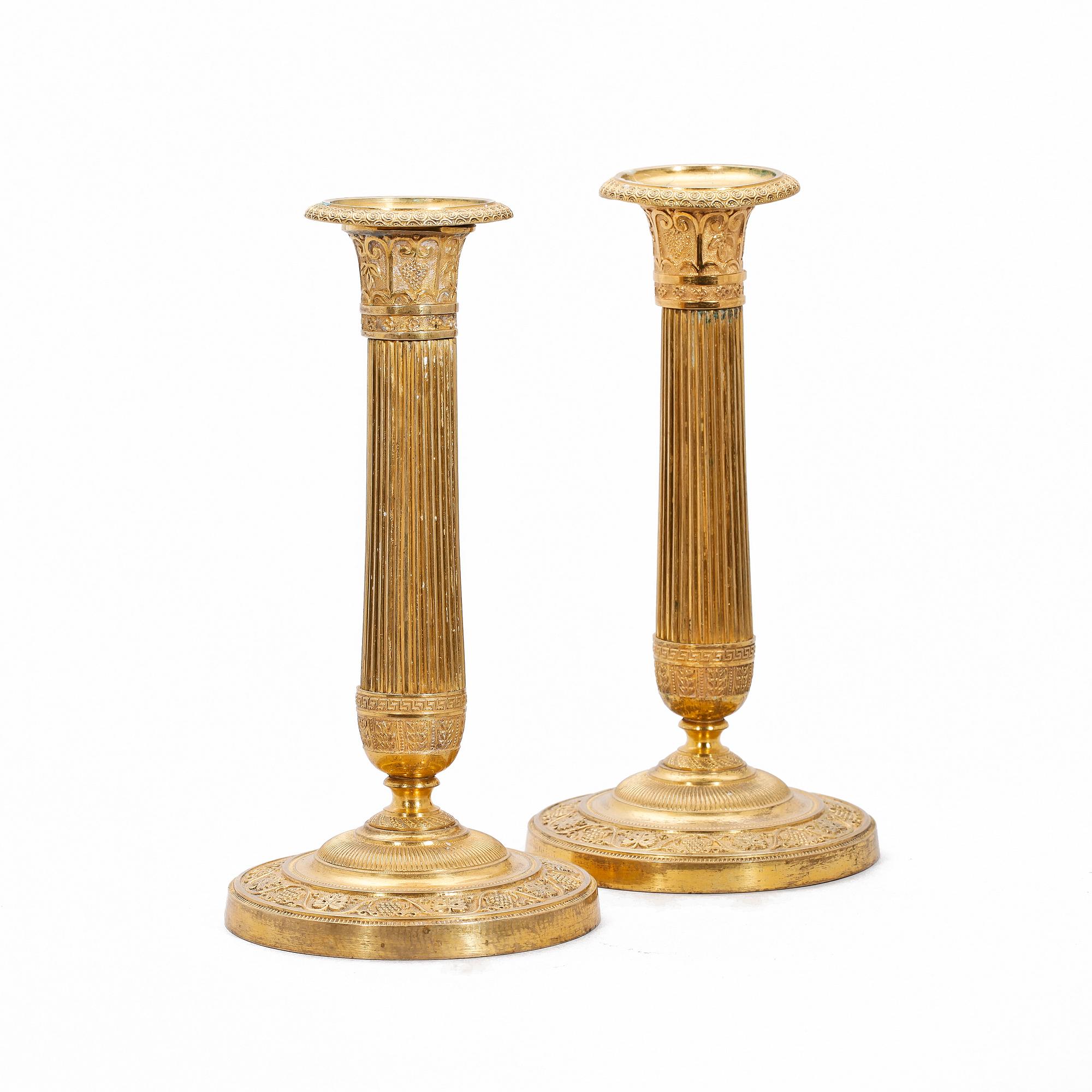 LJUSSTAKAR, ett par, empire, brons, 1800-talets första hälft.