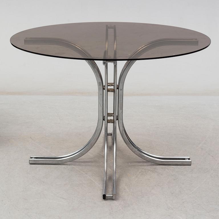 An Italian set of a glass table with four chromed metal chairs, 1970s.