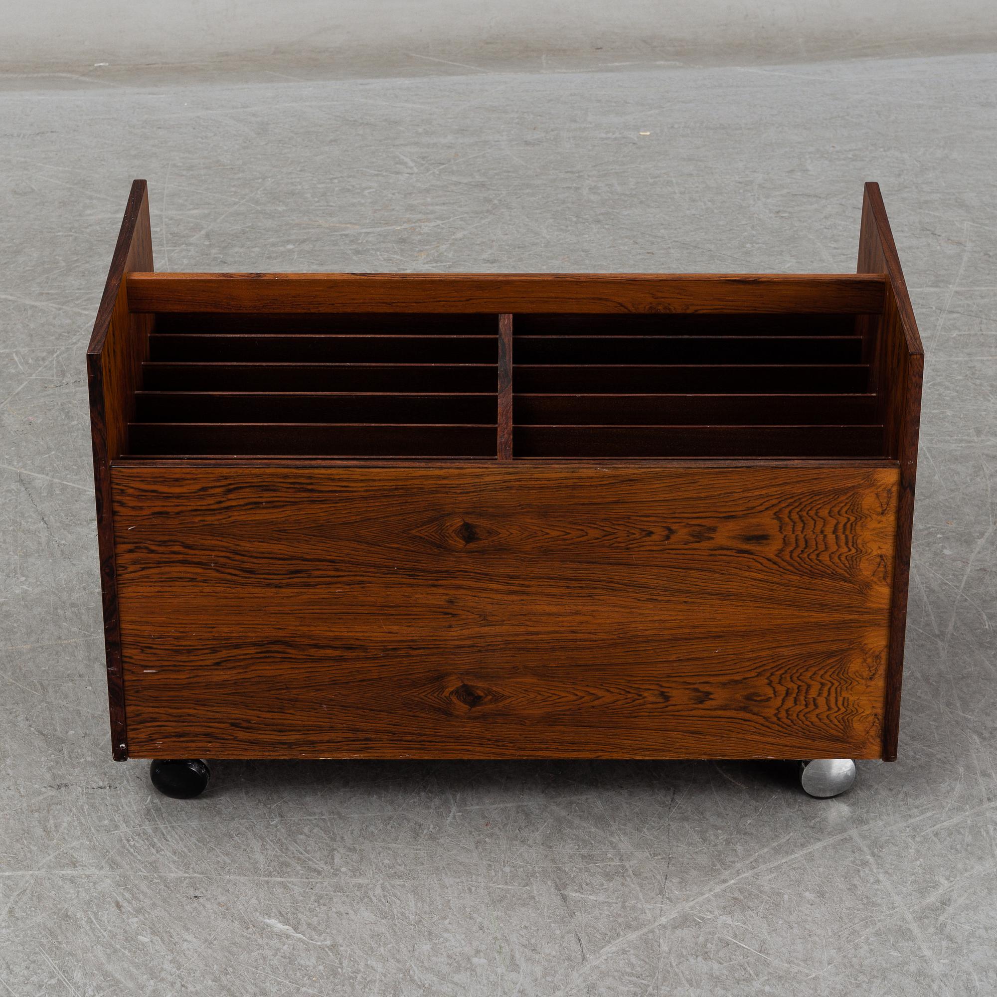 ROLF HESLAND, a rosewood veneered newspaper/LP stand from Bruksbo, Norway.