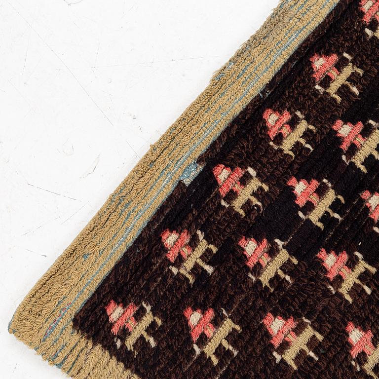 A knotted pile rug, Sweden/Finland, 18th/19th Century, c. 190 x 158 cm.