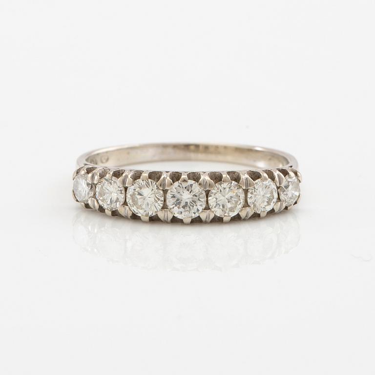 Half-eternity ring in 18K white gold set with round brilliant-cut diamonds, approximately 0.93 ct in total.