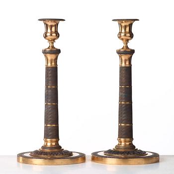 A pair of French Empire early 19th century candlesticks.