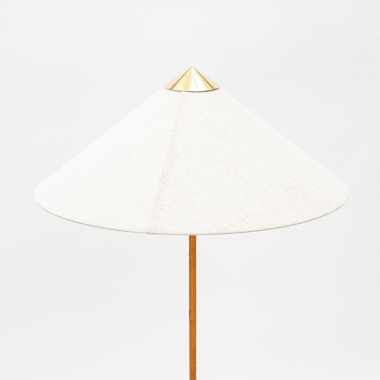 Paavo Tynell, A model 9602 brass and rattan floor lamp with canvas shade from Gubi,