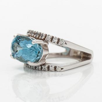 Ring, 14K white gold with an oval faceted aquamarine and diamonds.