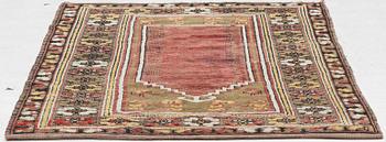 A prayer rug, approx. 140 x 98 cm.