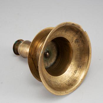 A 17th century bronze candlestick.