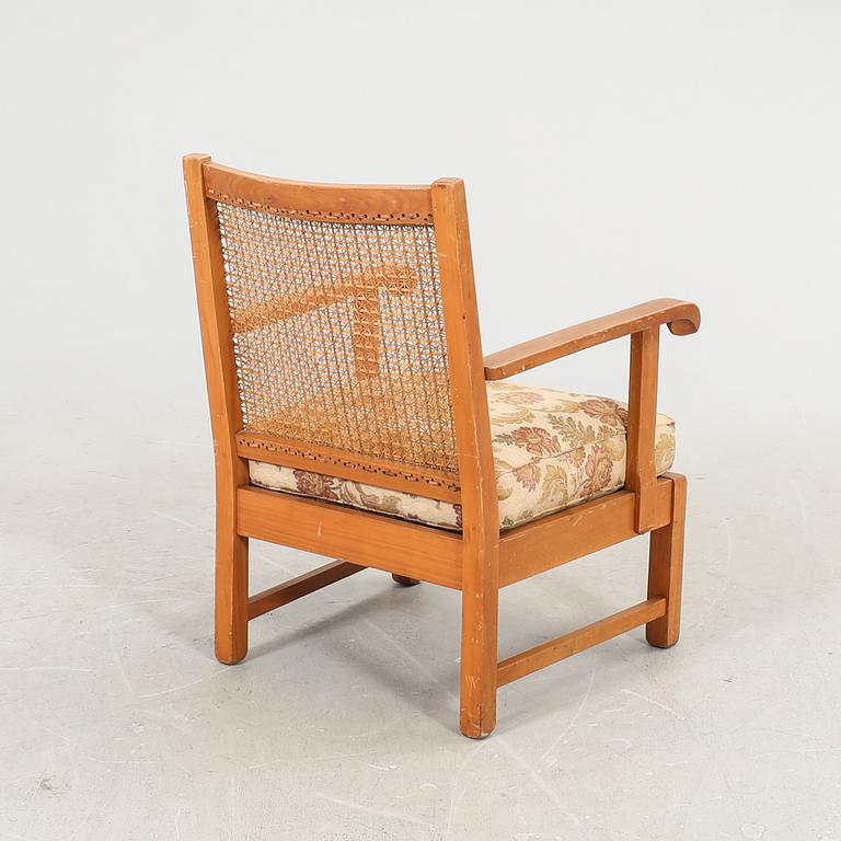 A 1940/50s rattan armchair.