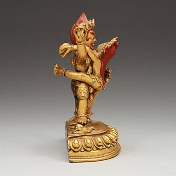 A gilt bronze figure of Vajrapani with consort in yabyum position, Nepal/Tibet, presumably early 20th Century.