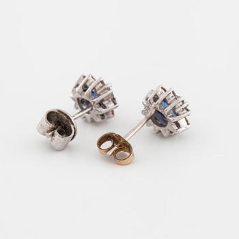 A pair of brilliant cut diamond and sapphire earrings.