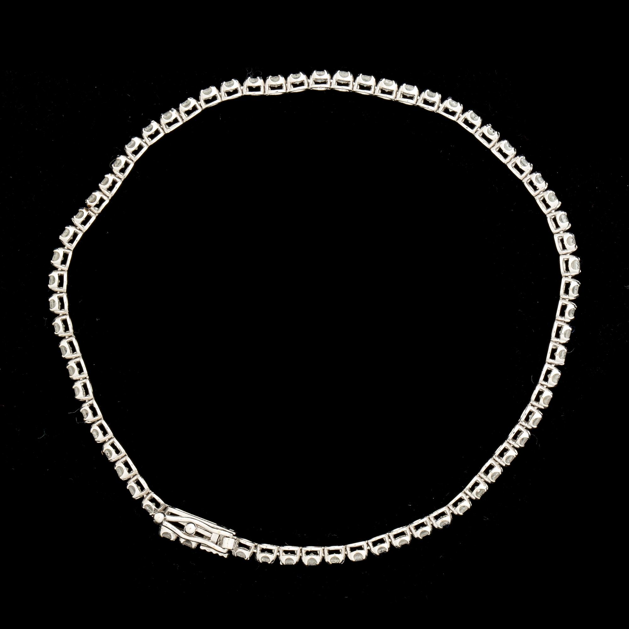 ARMLÄNK, 18 k guld med åttkantslipade diamanter ca 2,00 ct. Vikt ca 2,9 g.