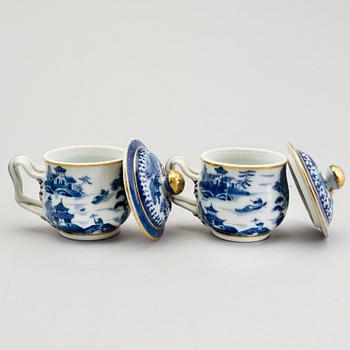 A set of twelve Chinese early 19th century export porcelain custard cups with lids.