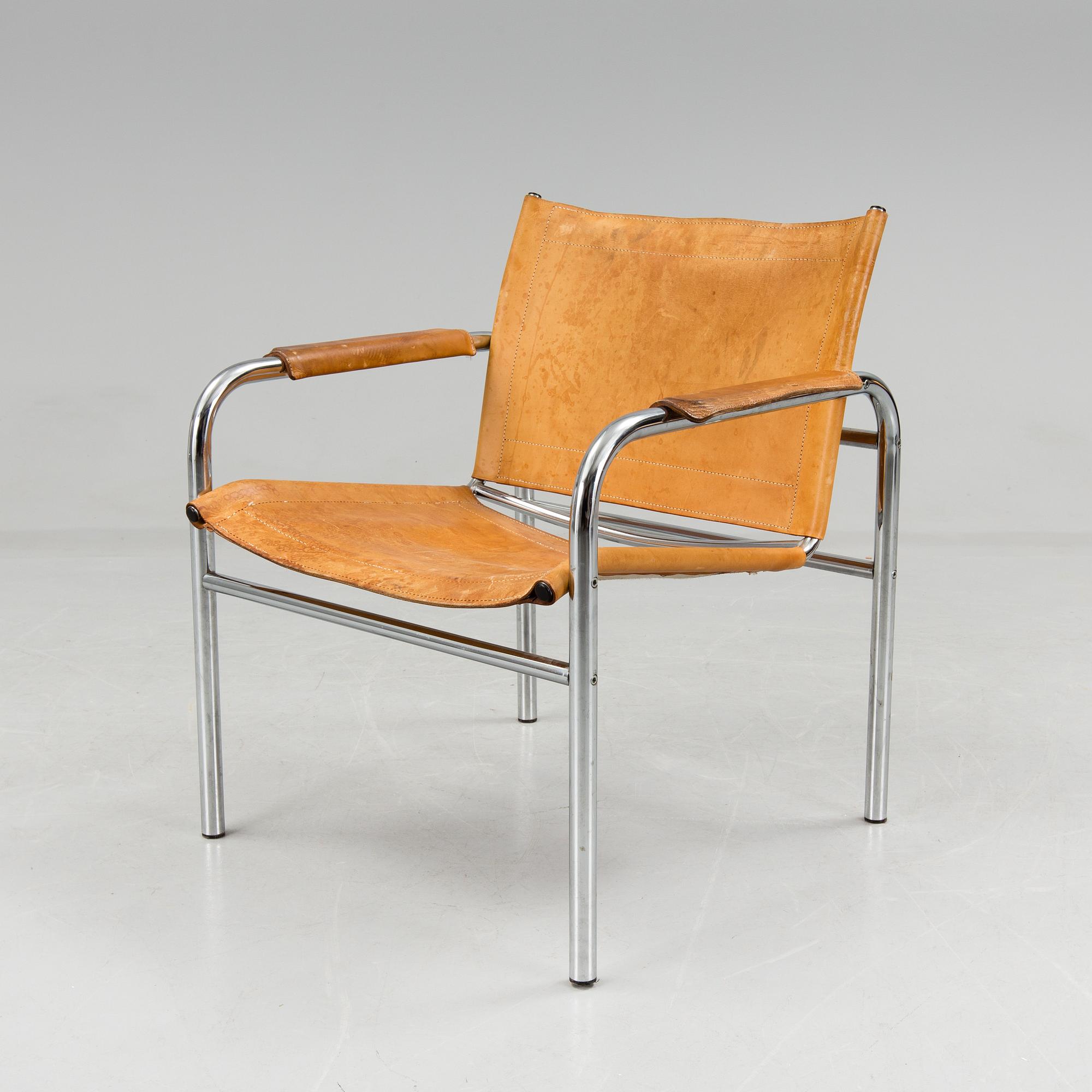 a leather and metal armchair, probably by IKEA.