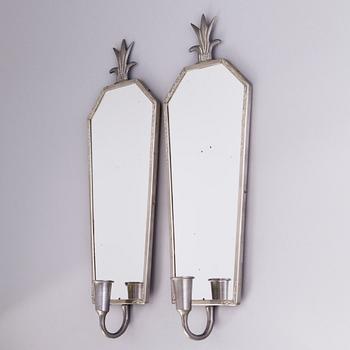 A pair of 1930s mirrored wall sconces.