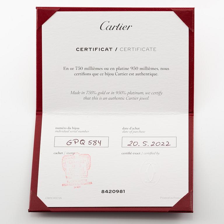 Cartier eternity ring in platinum with round brilliant-cut diamonds.