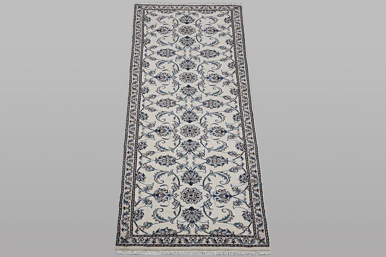 A runner carpet, Nain, part silk, ca 248 x 72 cm.