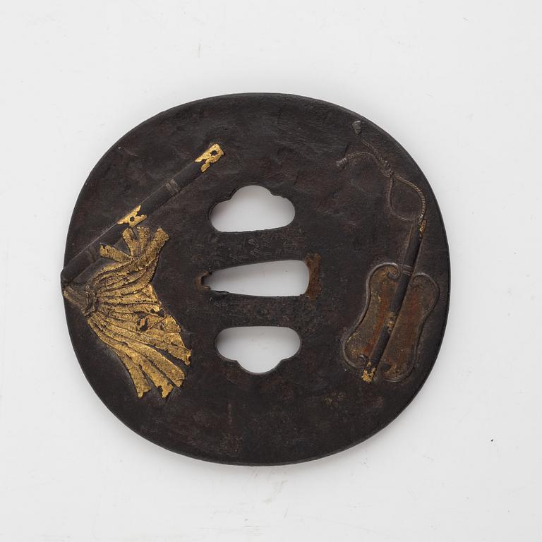 A Japanese gilt-bronze fan-shaped box and gilt iron tsuba with mei inscription, Meiji period (1868-1912).