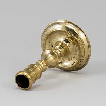 A bronze candlestick, 17th/18th century.