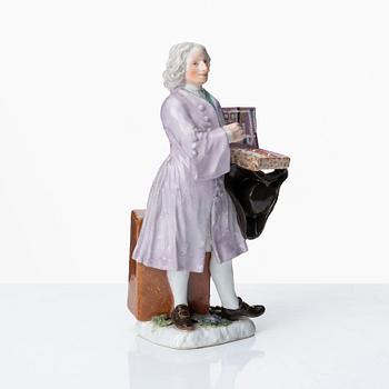 A Meissen porcelain figure of a trinket salesman from the series of Parisian street-traders, circa 1745.