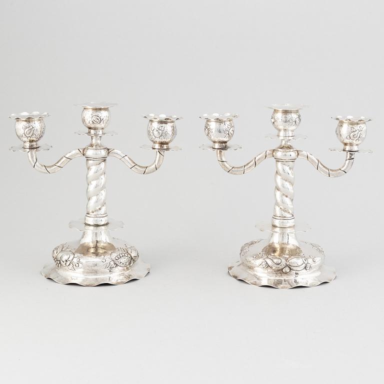 A pair of Swedish baroque-style silver candelabra, mark of CG Hallberg, Stockholm 1926.