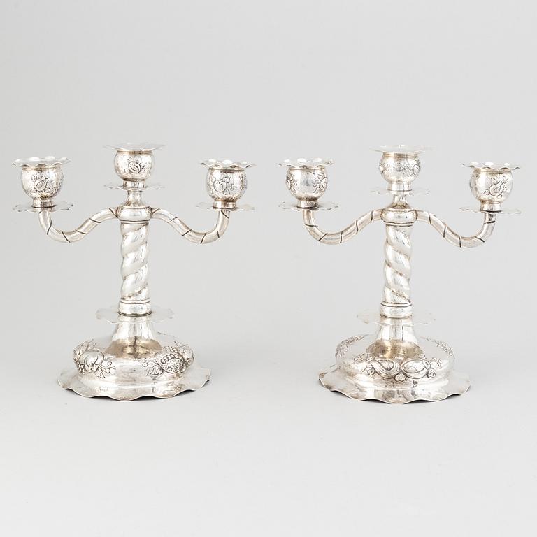 A pair of Swedish baroque-style silver candelabra, mark of CG Hallberg, Stockholm 1926.