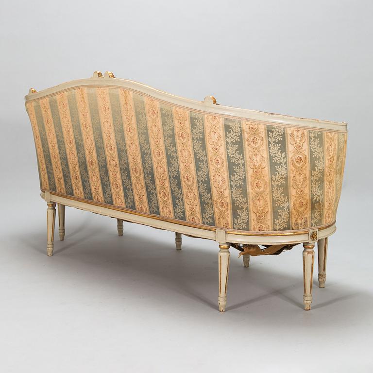 A Gustavian style sofa and table from early 20th century.