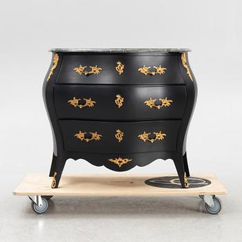 A Rococo style chest of drawers, mid 20th Century.