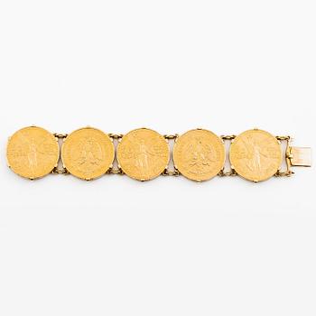 A bracelet gold set with mexican gold coins.
