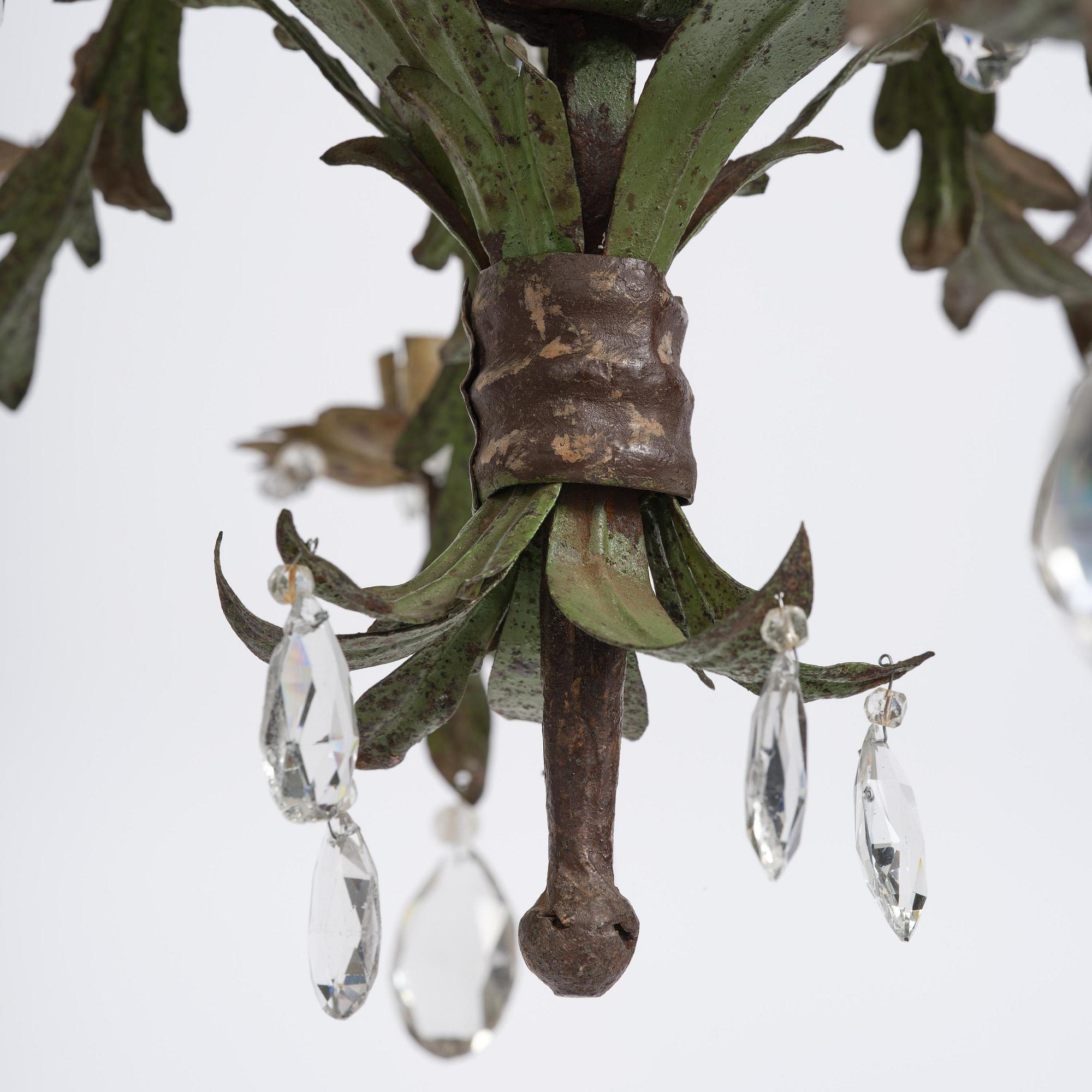 A North-Italian iron and tole-peinte eighteen-branch chandelier, 19th century.