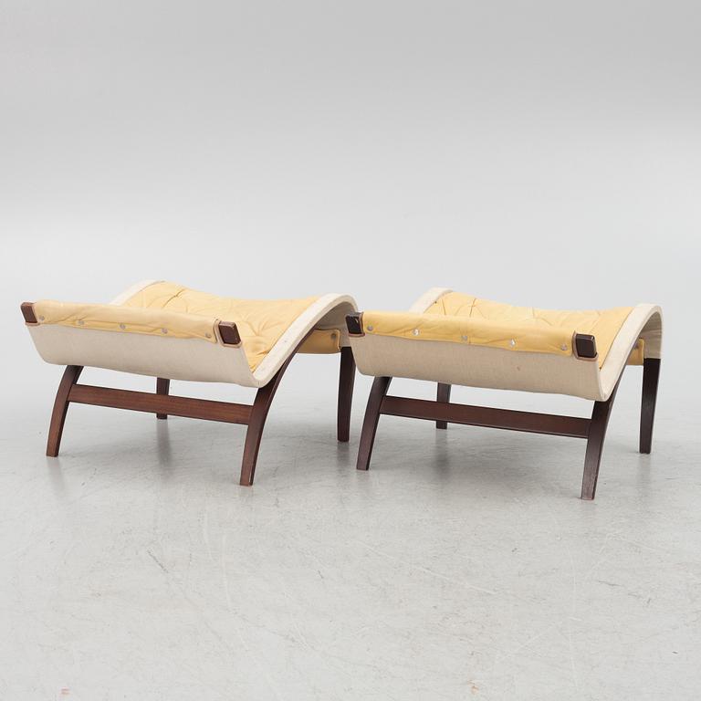 Bruno Mathsson, a pair of "Pernilla" armchair with ottoman, Dux, Sweden, second half of the 20th century.