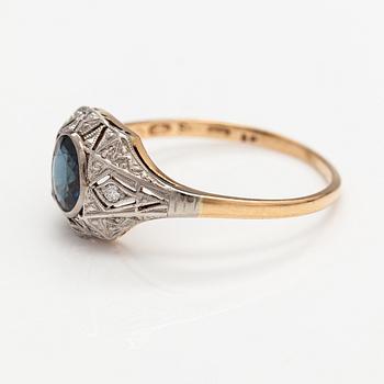 A 14K gold ring with diamonds ca. 0.02 ct in total and a sapphire. Finnish import marks.